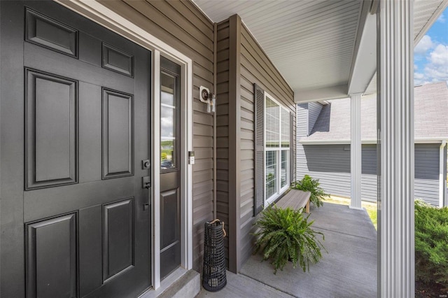 property entrance with covered porch