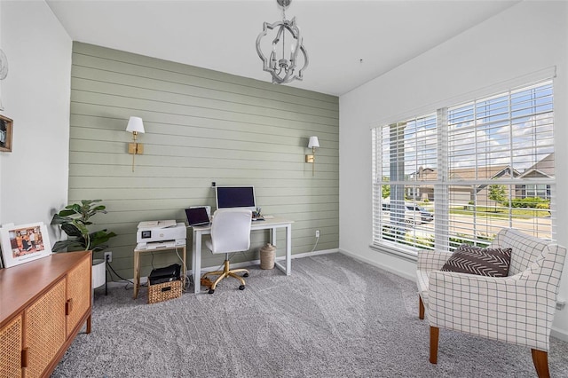 carpeted office space with wood walls