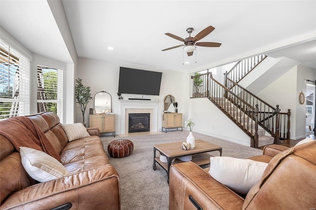 living room featuring carpet floors and ceiling fan