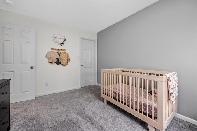 carpeted bedroom featuring a crib