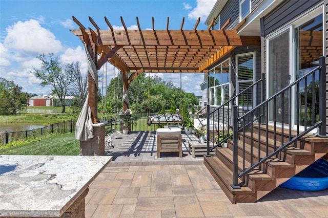 view of patio / terrace featuring an outdoor living space, a pergola, and a water view