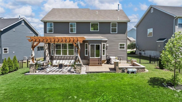 rear view of house featuring a patio, a yard, and a pergola