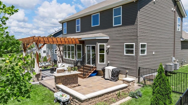 rear view of house with central AC unit, a pergola, and a patio