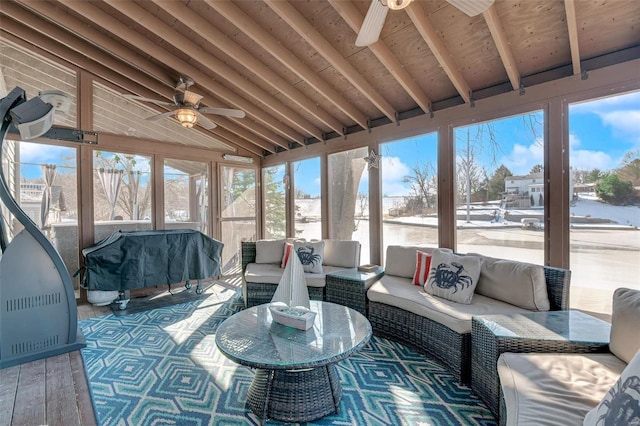 sunroom / solarium with wood ceiling, vaulted ceiling with beams, and ceiling fan