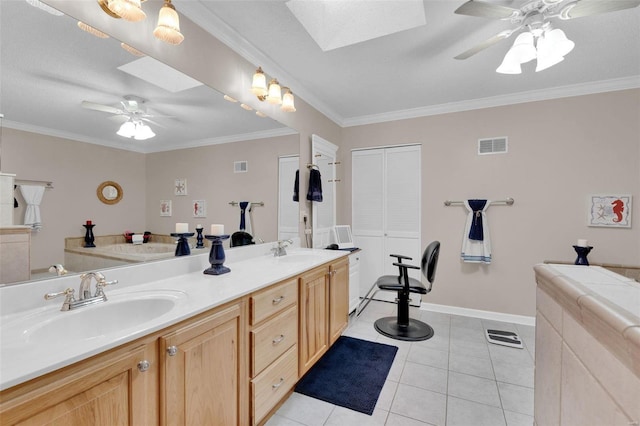 full bathroom featuring a skylight, ceiling fan, visible vents, and a sink