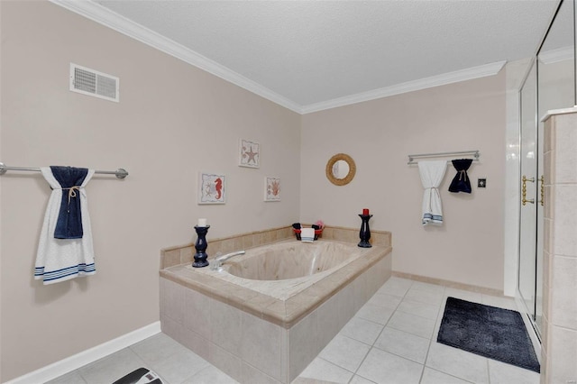 bathroom featuring a garden tub, tile patterned flooring, visible vents, and crown molding