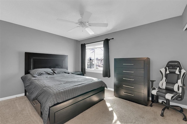 bedroom with carpet, baseboards, and ceiling fan