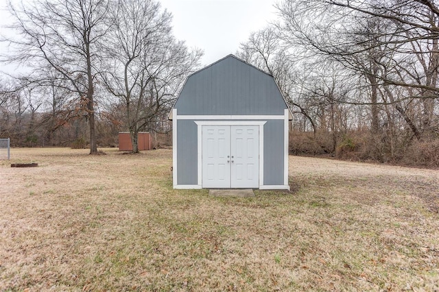 view of outdoor structure with a lawn