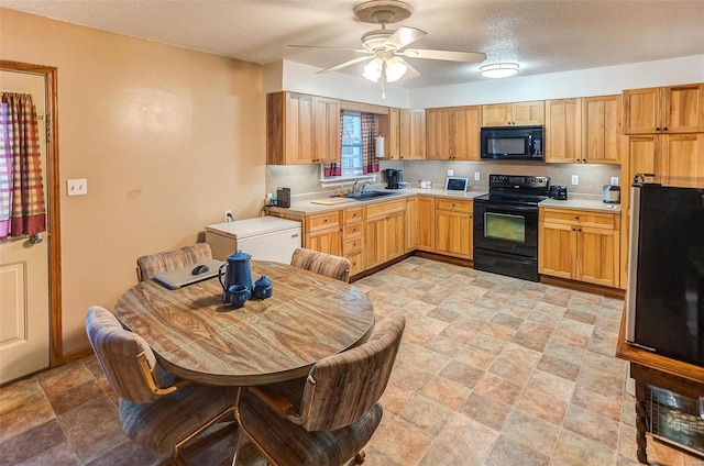 kitchen with sink, black appliances, a textured ceiling, ceiling fan, and backsplash