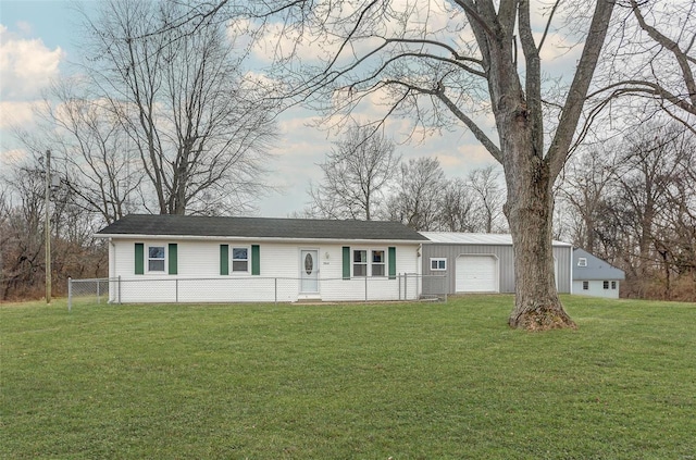 ranch-style home with a garage and a front lawn