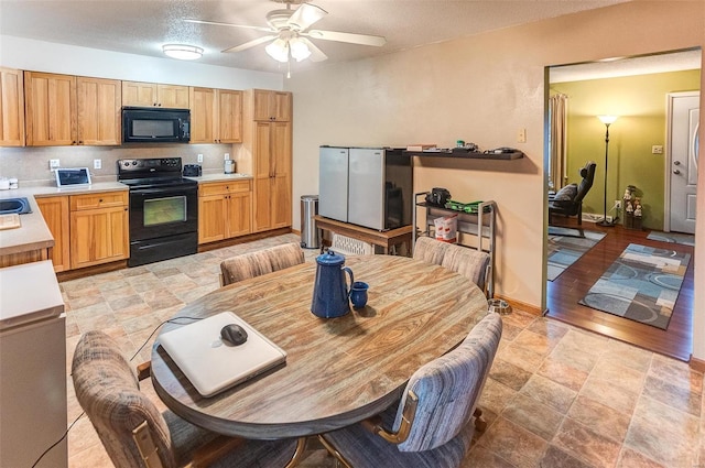 kitchen with backsplash, black appliances, and ceiling fan