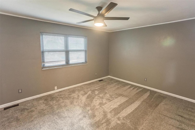 carpeted empty room with crown molding and ceiling fan