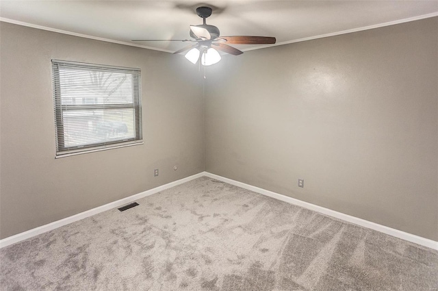 unfurnished room with crown molding, carpet floors, and ceiling fan