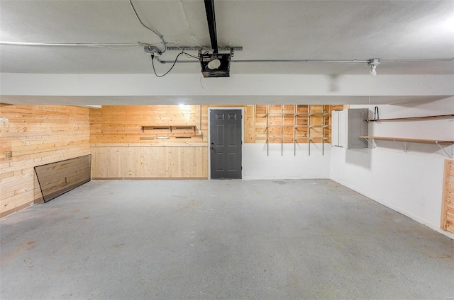 garage featuring wood walls