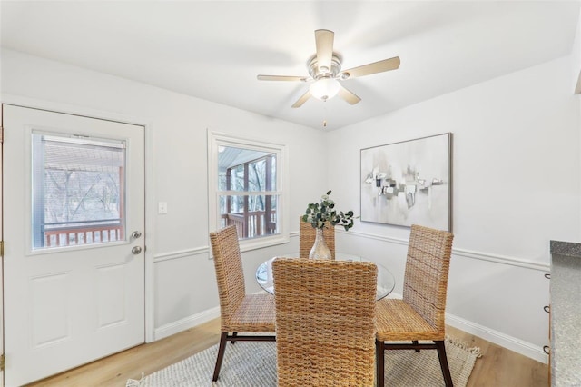 dining room featuring ceiling fan and light wood-type flooring