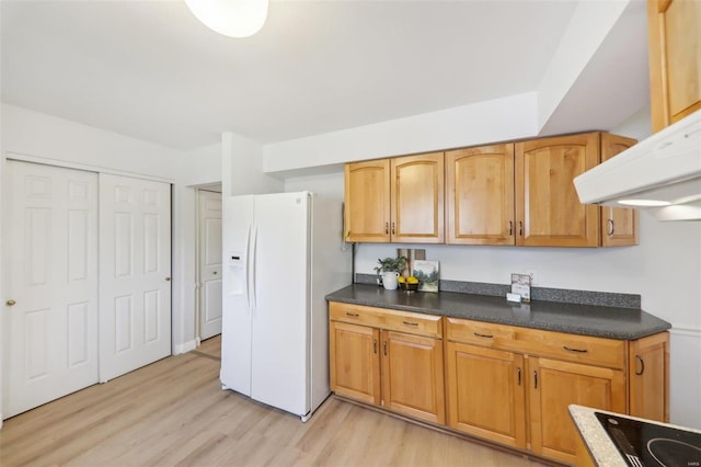 kitchen with black electric cooktop, light hardwood / wood-style flooring, and white fridge with ice dispenser