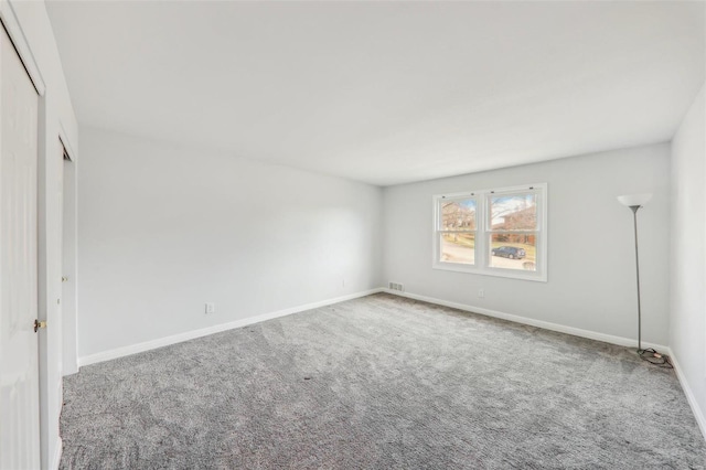 unfurnished bedroom featuring a closet and carpet