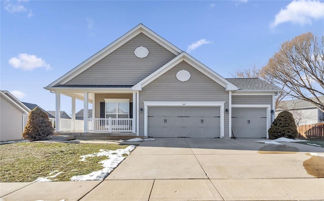 view of front of house featuring a garage and covered porch