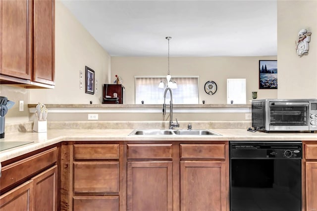 kitchen with dishwasher, sink, and hanging light fixtures