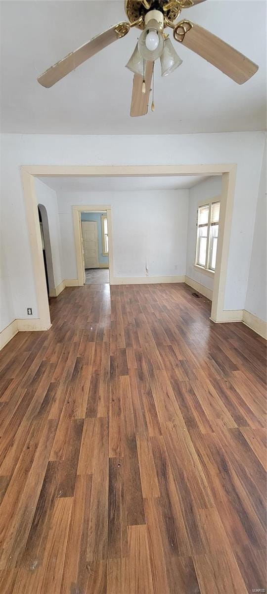 interior space featuring ceiling fan and dark hardwood / wood-style floors