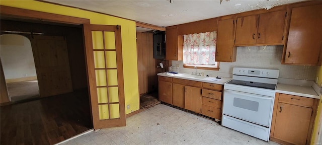 kitchen with sink, electric panel, and white range with electric cooktop