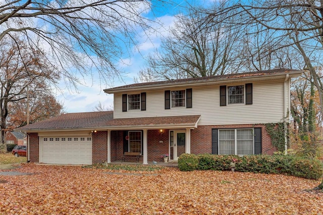 front of property with a garage and covered porch