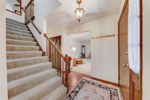 foyer entrance with tile patterned flooring