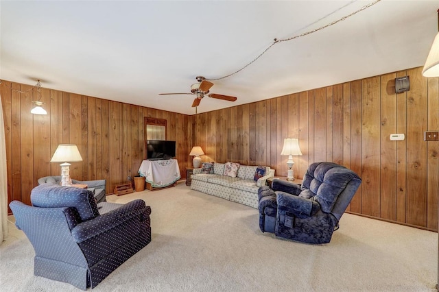 living room featuring light colored carpet and wood walls