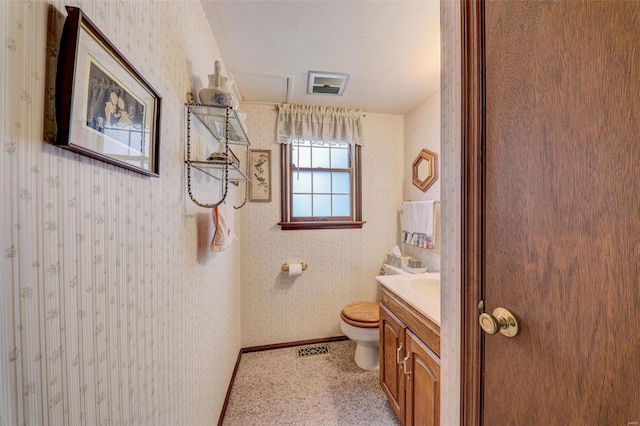 bathroom with vanity and toilet