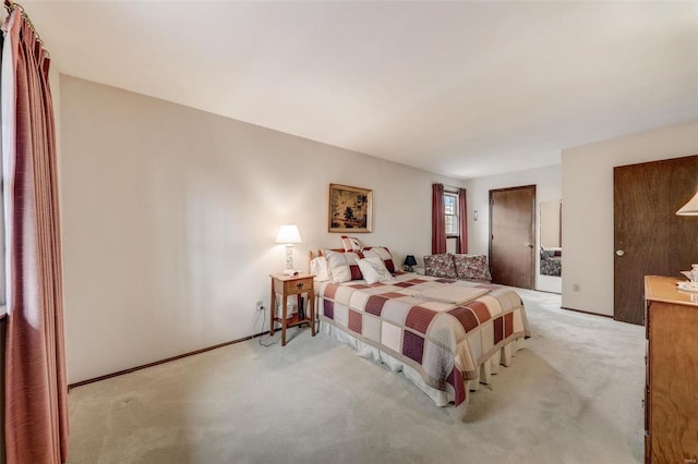 bedroom featuring light carpet