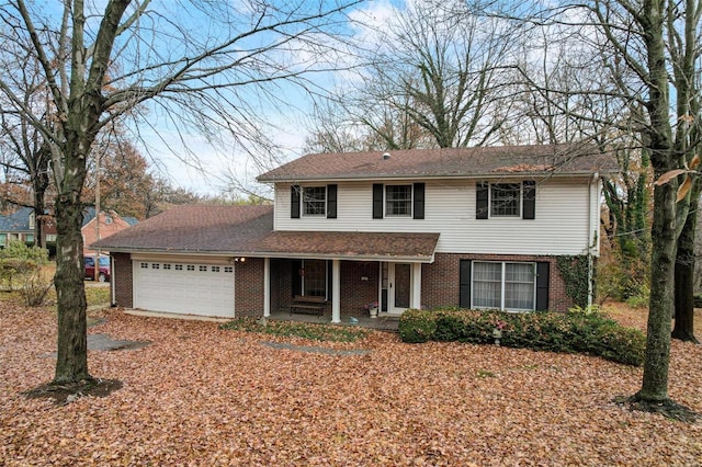 front facade with a garage and a porch