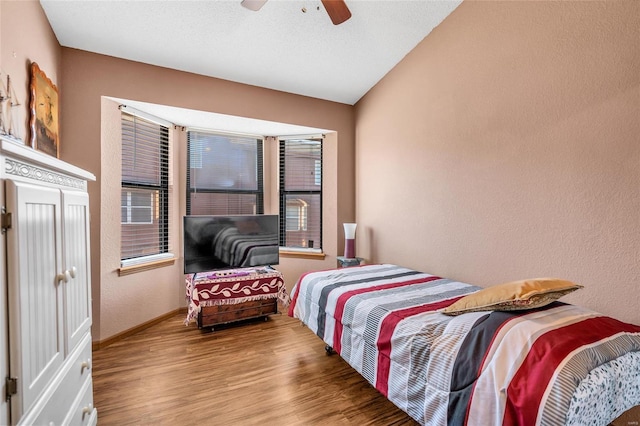 bedroom featuring hardwood / wood-style flooring and ceiling fan