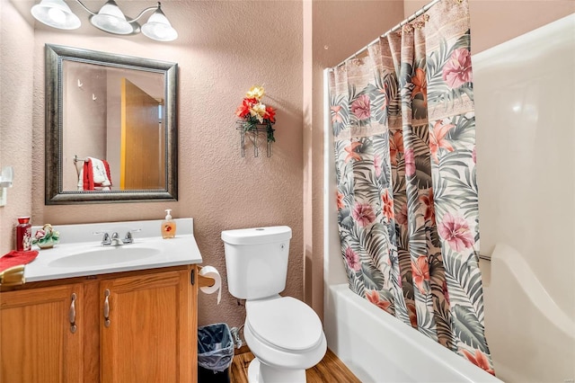 full bathroom featuring vanity, toilet, and shower / bathtub combination with curtain