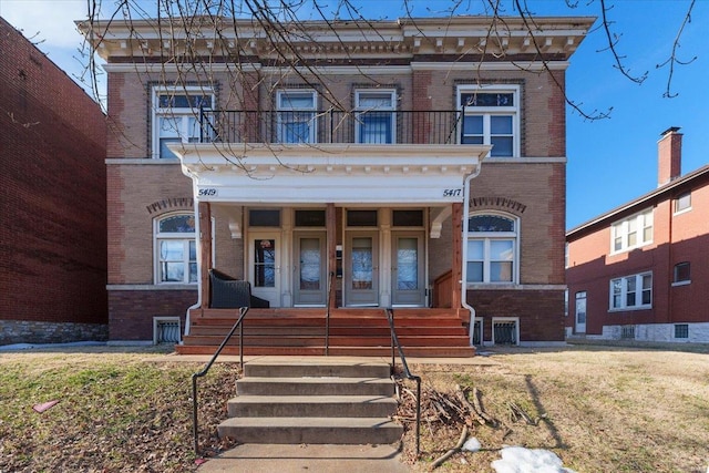 view of front facade with a balcony