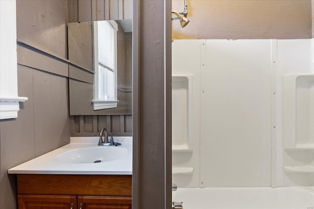 bathroom with vanity and bathtub / shower combination