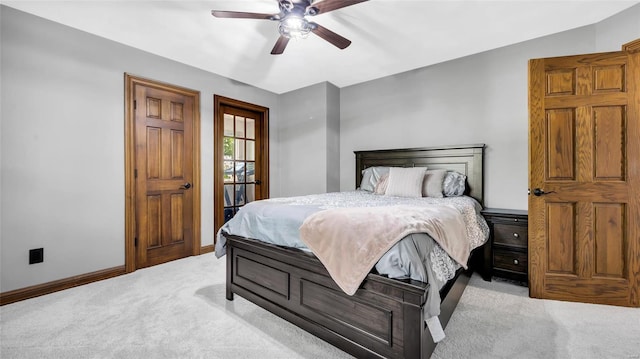 bedroom featuring light carpet and ceiling fan