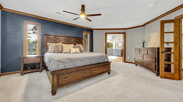 bedroom with crown molding, ensuite bath, light colored carpet, and ceiling fan