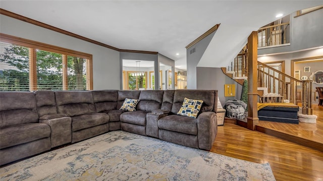 living room with ornamental molding and hardwood / wood-style floors