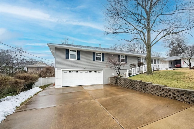 view of front facade featuring a garage and a front lawn