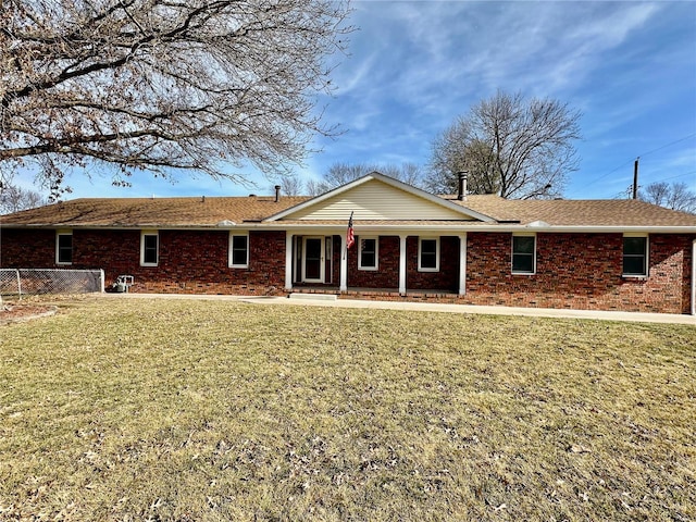 rear view of house with a lawn