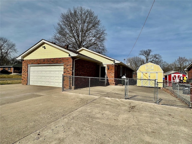 view of home's exterior with a garage and a shed