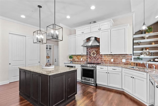 kitchen with white cabinetry, decorative light fixtures, wall chimney range hood, and electric stove