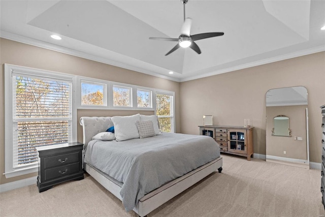 carpeted bedroom with crown molding, a raised ceiling, and ceiling fan