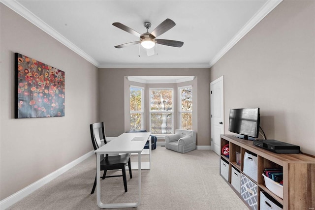 carpeted home office with crown molding and ceiling fan