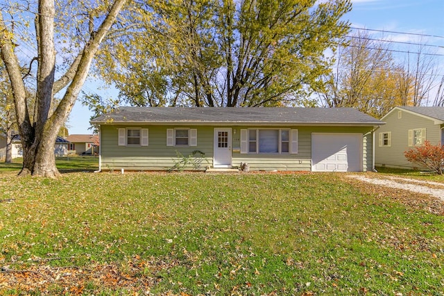 single story home featuring a garage and a front yard