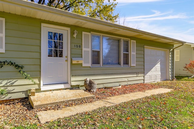 property entrance featuring a garage