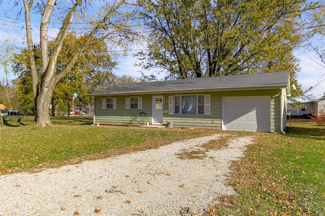 view of front of house with a garage and a front yard