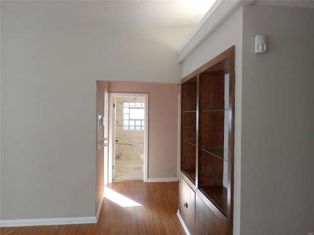 hallway with light wood-type flooring