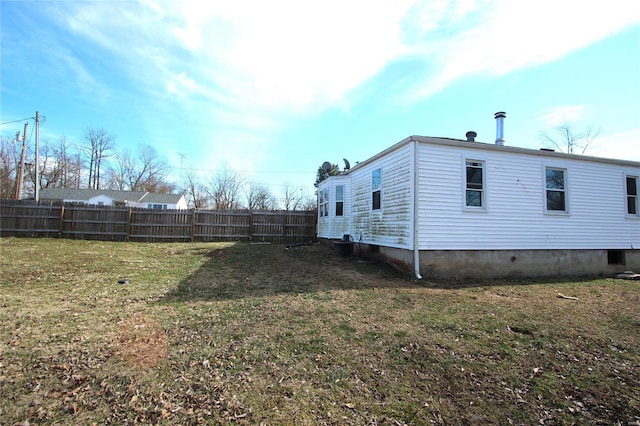 view of property exterior with a lawn