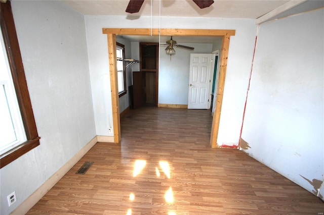 corridor with light hardwood / wood-style flooring